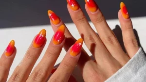 The Sunset Aura Manicure Trend Brings Endless Summer Energy to Your Nails