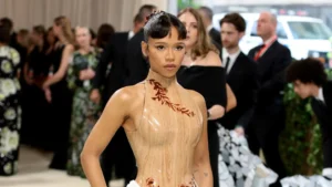Taylor Russell stuns in white ruched dress at Met Gala afterparty, Harry Styles absent.