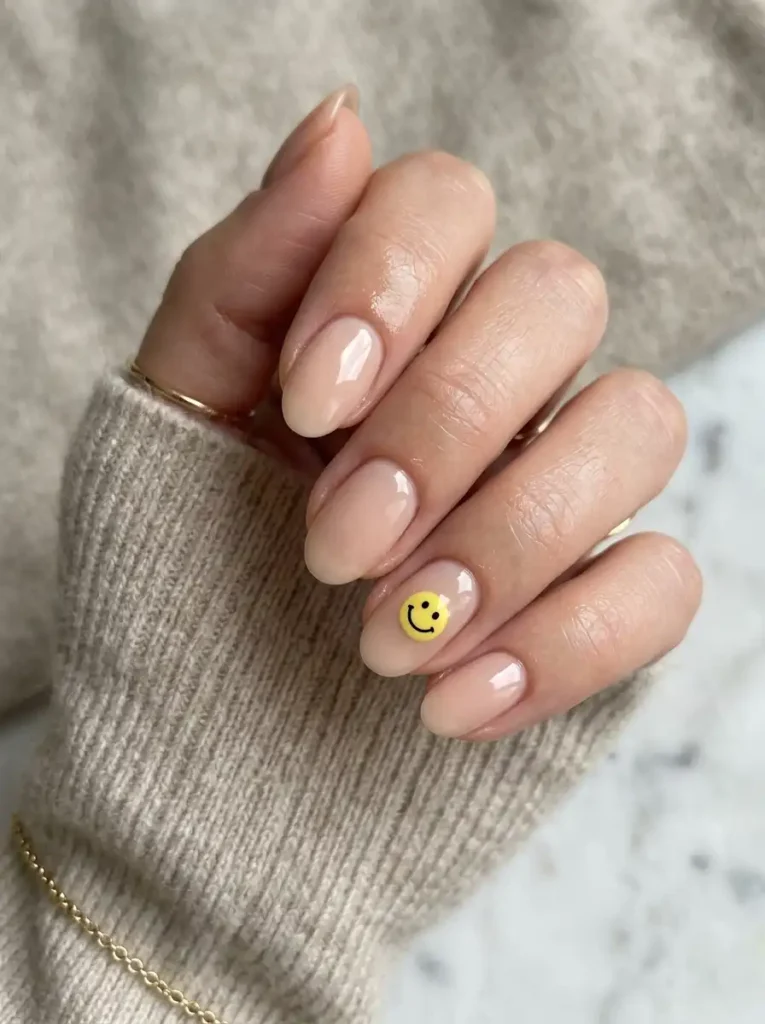 Chic and happy nail art on oval nails.