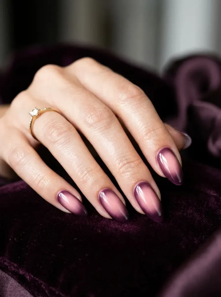 Pink nail inspiration featuring a moody dark aura gradient.