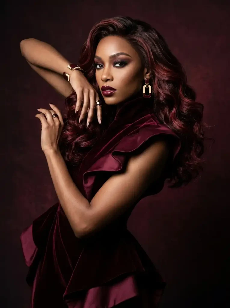 deep wine-red mahogany balayage highlights with rich dimension, editorial portrait